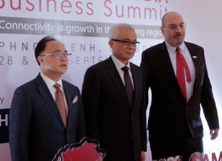 Kith Meng, DPM Aun Pornmoniroth and Tassilo Brinzer pose for photo at the ASEAN-Cambodia Business Summit 2023
