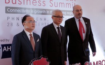 Kith Meng, DPM Aun Pornmoniroth and Tassilo Brinzer pose for photo at the ASEAN-Cambodia Business Summit 2023