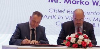 Tassilo Brinzer, EuroCham Cambodia Chairman, and Marko Walde, AHK Vietnam Chief Representative, sign an MoU at the ASEAN-Cambodia Business Summit 2023