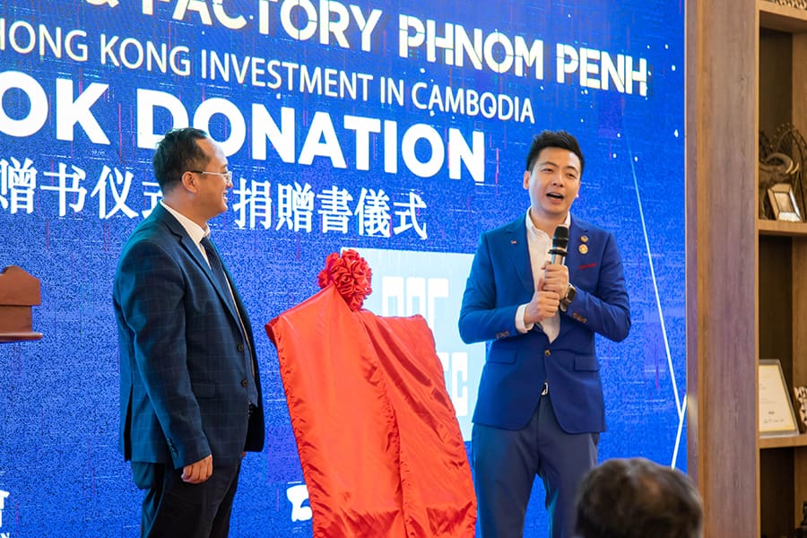 Dr. Ben Li delivering remarks during the book donation ceremony with CC3.