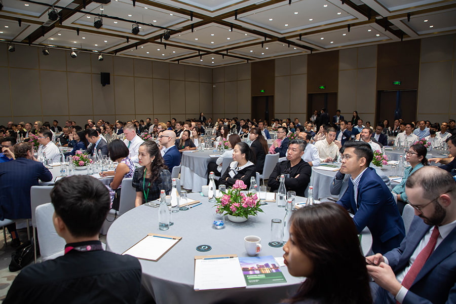 Guests sit on tables at the CBRE Cambodia 'Fearless Forecast 2024' event